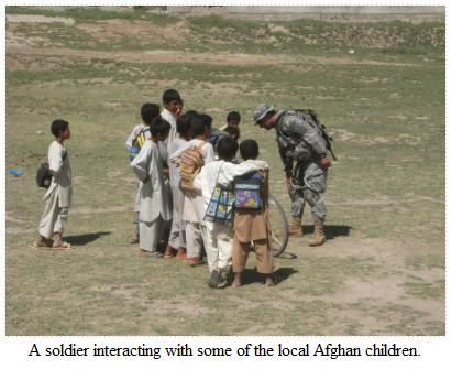 A soldier with local children